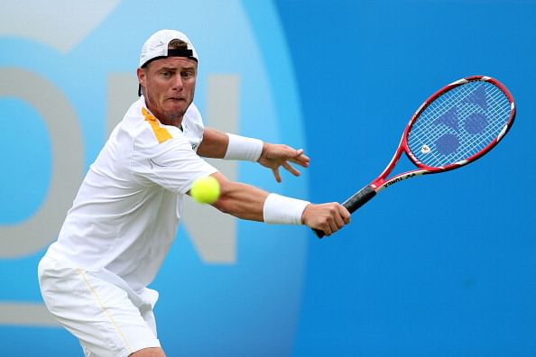 Hewitt rolls back years to down Dimitrov at Queen's