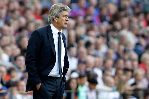 Head coach Manuel Pellegrini of Malaga CF looks on during the La Liga match between FC Barcelona and Malaga CF at Camp Nou on June 1, 2013 in Barcelona, Spain.  (Photo by David Ramos/Getty Images)