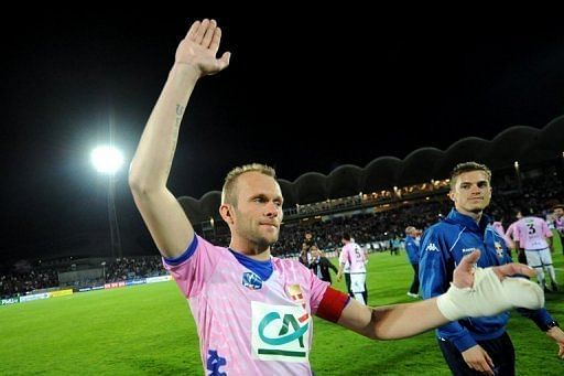 Evian captain Olivier Sorlin acknowledges fans after their French Cup match against PSG, on April 18, 2013