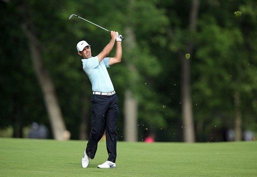 Charl Schwartzel of South Africa hits his second shot on the par 4 13th hole on May 30, 2013, in Dublin, Ohio