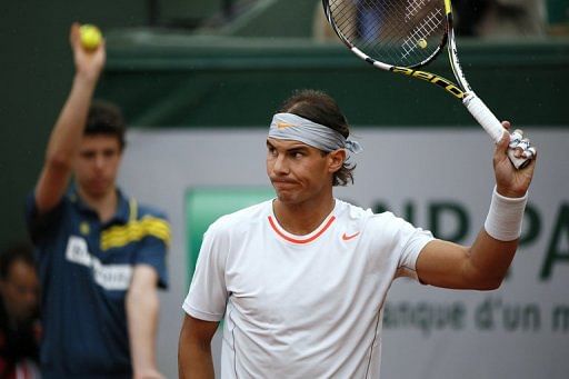 Rafael Nadal acknowledges the crowd at  Roland Garros in Paris, on May 30,  2013