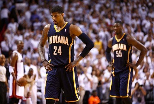 Paul George (L) and Roy Hibbert of the Pacers walk to the bench in the game against the Heat, in Miami, on May 30, 2013