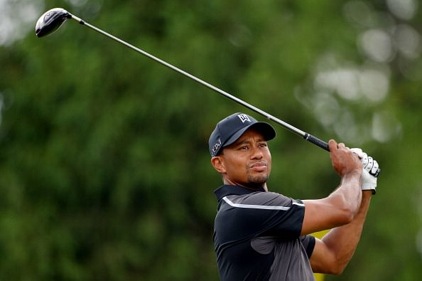 Golf: Tiger chasing more history at muddy Merion
