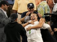 Maria Sharapova hugs her coach as she celebrates with family
