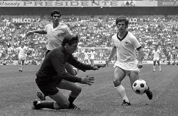 Football, 1970 World Cup Third Place Play-Off, Azteca Stadium, Mexico, 20th June 1970, West Germany 1 v Uruguay 0, Uruguayan goalkeeper Ladislao Mazurkiewicz saves at the feet of West German striker Gerd Muller watched by Atilio Ancheta (left) during the