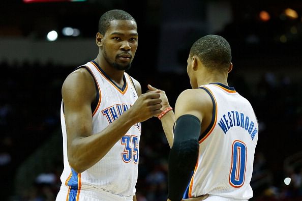 Kevin Durant #35 and Russell Westbrook #0 of the Oklahoma City Thunder get ready for the game against the Houston Rockets at Toyota Center on February 20, 2013 in Houston, Texas. (Getty Images)