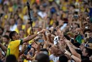 Neymar celebrates with fans at the end of the FIFA Confederations Cup Brazil 2013 Final match between Brazil and Spain at Maracana on June 30, 2013 in Rio de Janeiro, Brazil. (Getty Images)