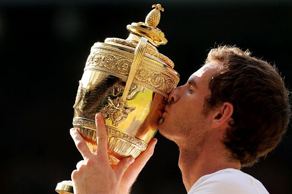 Murray kisses the Gentlemen&#039;s Singles Trophy following his victory in the Final  against Djokovic at the All England Club on July 7, 2013 in London, England.  (Getty Images)