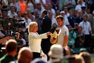 Murrayspeaks with Sue Barker as he holds the Gentlemen's Singles Trophy following his victory in the Final against Djokovic at the All England Club on July 7, 2013 in London, England. (Getty Images)