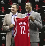 Houston Rocktes head coach Kevin McHale (L) and Dwight Howard hold up his new jersey during a press conference on July 13, 2013 in Houston, Texas. (Getty Images)