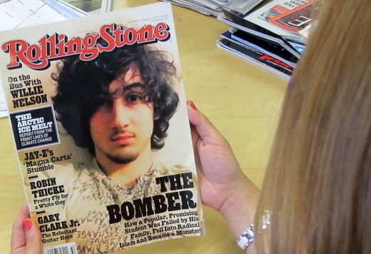 An early copy of Rolling Stone magazine&#039;s August 2013 issue featuring the cover story on Boston bombing suspect Dzhokhar Tsarnaev, which triggered criticism that the magazine was &quot;glamorizing terrorism&quot;. The  article, titled &quot;The Bomber,&quot; was described by the magazine as a &quot;deeply reported account of the life and times&quot; of Tsarnaev.  (AFP/Getty Images)