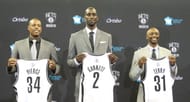 Kevin Garnett #2, Paul Pierce #34, and Jason Terry #31 of the Brooklyn Nets pose with their new jerseys during a press conference at the Barclays Center on July 18, 2013 in the Brooklyn borough of New York City. (Getty Images)