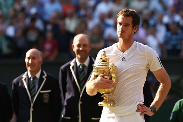 Andy Murray posing with his long-cherished trophy