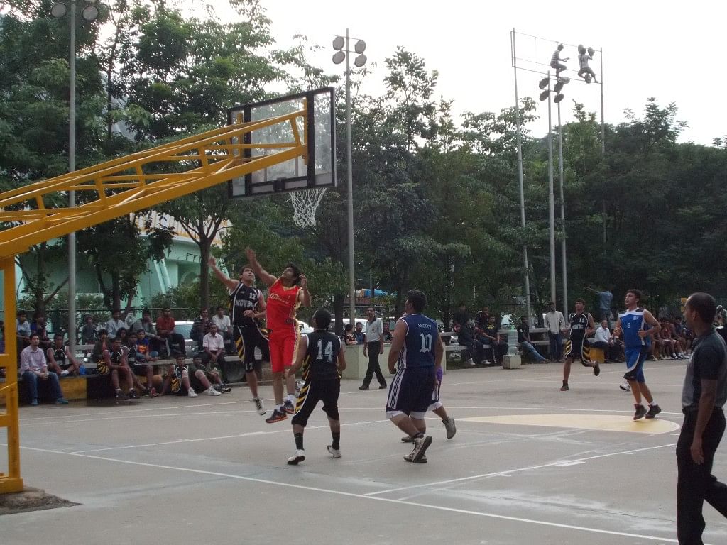 National Games Village Basketball Club (in blue) seen here against Rovers, Dharwad. NGV prevailed easily in the end. Copyright: Gopalakrishnan R