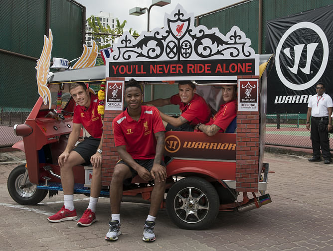 Liverpool FC players ride Warrior LFC Tuk Tuk in Bangkok