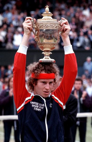 Tennis. 1981, Wimbledon Men's singles champion, USA's John McEnroe, celebrates with the trophy.