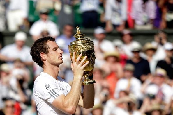 Andy Murray of Great Britain poses with the Gentlemen&#039;s Singles Trophy following his victory in the Gentlemen&#039;s Singles Final match against Novak Djokovic of Serbia on day thirteen of the Wimbledon Lawn Tennis Championships at the All England Lawn Tennis and Croquet Club on July 7, 2013 in London, England. 
