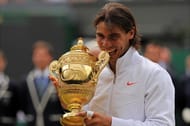 Spain's Rafael Nadal bites the Wimbledon