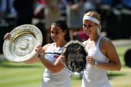 Marion Bartoli of France poses with the Venus Rosewater Dish trophy next to Sabine Lisicki of Germany and her runner-up trophy after their Ladies' Singles final match on day twelve of the Wimbledon Lawn Tennis Championships at the All England Lawn Tennis and Croquet Club on July 6, 2013 in London, England. (Getty Images)