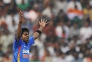 Indian cricketer R. Vinay Kumar celebrat