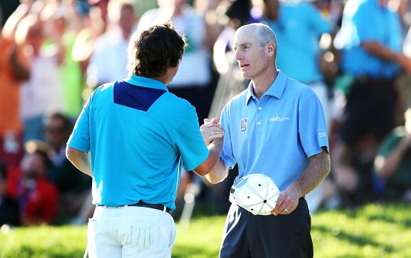 Jason Dufner of the United States is congratulated by playing partner Jim Furyk on the 18th green after his two-stroke victory at the 95th PGA Championship at Oak Hill Country Club on August 11, 2013 in Rochester, New York.  (Getty Images)