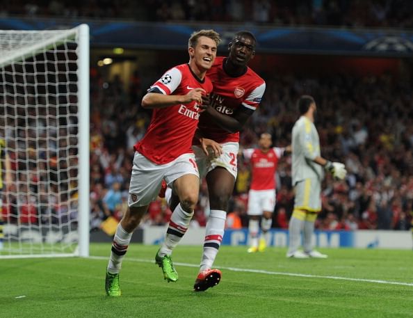Ramsey double helps Arsenal into UEFA Champions League group stages