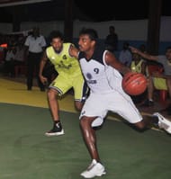 Albin Baby (in white) for KSEB agaist Customs. Customs won the Match. Photo Courtesy: Kerala Basketball Association