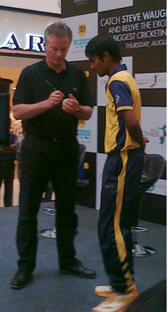 Steve Waugh signing a ball for a fan