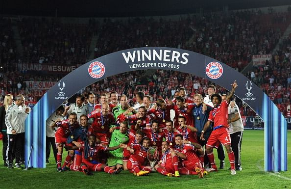 Bayern Munich players celebrate with the UEFA Super Cup trophy 