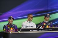 Pole sitter Lewis Hamilton (C) of Great Britain and Mercedes GP attends the drivers press conference with second placed Sebastian Vettel (L) of Germany and Infiniti Red Bull Racing and third placed Mark Webber (R) of Australia and Infiniti Red Bull Racing following qualifying for the Belgian Grand Prix at Circuit de Spa-Francorchamps