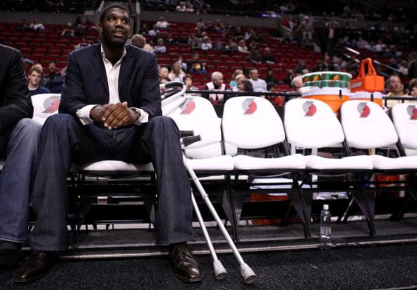 Greg Oden #52 of the Portland Trail Blazers, who is out for the season after under going micro fracture surgery in his knee, sits on the bench to watch a pre-season game against the Los Angeles Clippers at the Rose Garden on October 10, 2007 in Portland, Oregon.   (Getty Images)
