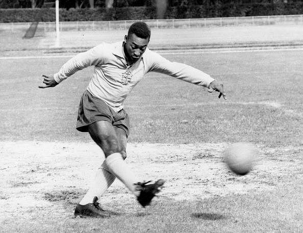 The famous Brazilian football legend Pele playing football. Circa 1950+s.