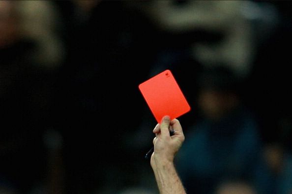 Football player shown a red card for exposing his privates to referee