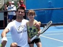 Video: Novak Djokovic takes on young fan while training