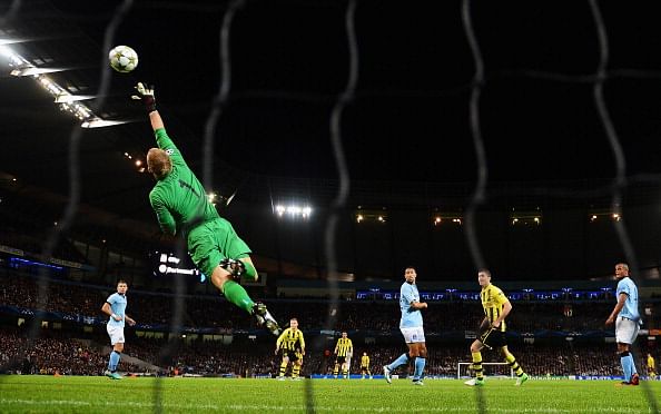 Joe Hart of Manchester City makes a save during the UEFA Champions League Group D match between Manchester City and Borussia Dortmund at the Etihad Stadium