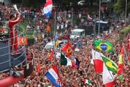 Fernando Alonso celebrates on the podium in front of the Tifosi after finishing second