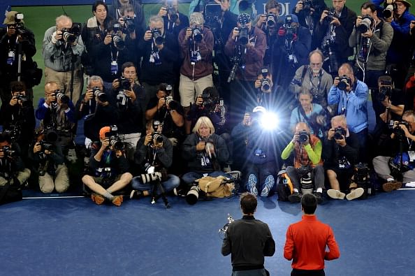 Photographers take pictures of Rafael Nadal of Spain as he poses with the US Open Championship trophy next to Novak Djokovic of Serbia after winning the men&#039;s singles final match on Day Fifteen of the 2013 US Open at the USTA Billie Jean King National Tennis Center on September 9, 2013 in the Flushing neighborhood of the Queens borough of New York City.  (Getty Images)