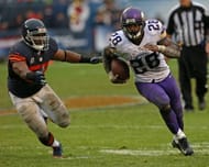 Adrian Peterson #28 of the Minnesota Vikings is chased by Lance Briggs #55 of the Chicago Bears at Soldier Field on September 15, 2013 in Chicago, Illinois. The Bears defeated the Vikings 31-30. (Getty Images)
