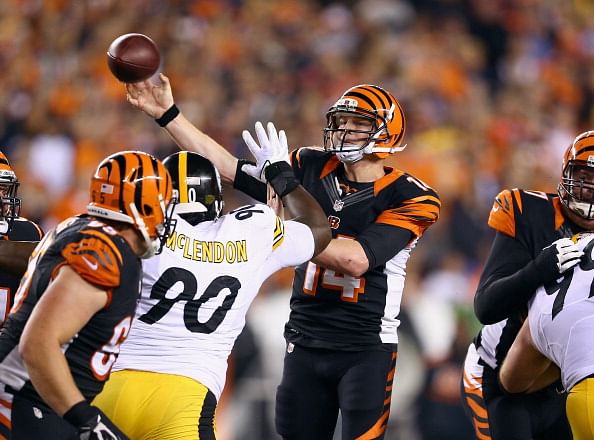 Andy Dalton #14 of the Cincinnati Bengals throws a pass during the NFL game against the Pittsburgh Steelers at Paul Brown Stadium on September 16, 2013 in Cincinnati, Ohio.  (Getty Images)