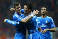 Real Madrid's Christiano Ronaldo (C) celebrates his goal against Galatasaray with Gareth Bale (L)