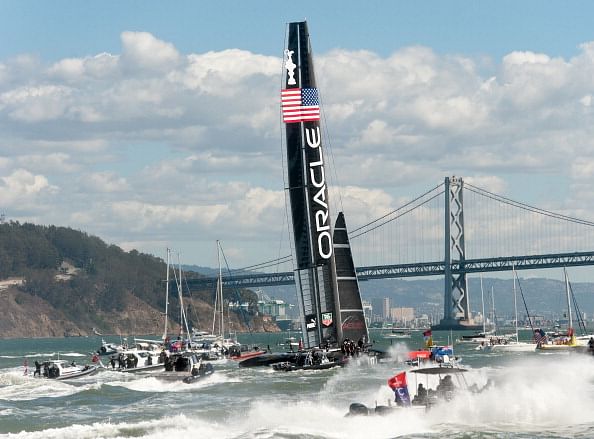Fleet and spectator boats follow Oracle Team USA as it celebrates its victory over Emirates Team New Zealand in the 34th America&#039;s Cup