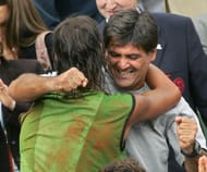 Rafael Nadal (L) hugs his coach and uncle Toni Nadal after defeating Mariano Puerta in their men's final of the French Open at Roland Garros on 05 June 2005 in Paris. (Getty Images)