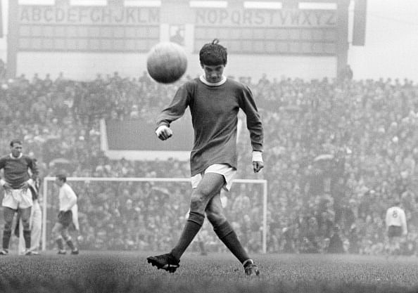 George Best in action for Manchester United, at Old Trafford in Manchester, 1964.