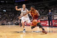 Kyrie Irving #2 of the Cleveland Cavaliers dribbles against Manu Ginobili #20 of the San Antonio Spurs