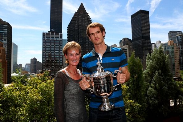 Andy Murray of Great Britain poses with the US Open Championship trophy next to his mother Judy Murray