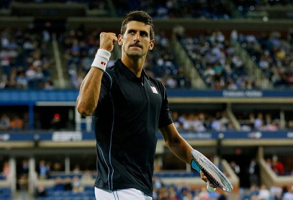 US Open 2013: Novak Djokovic overcomes Mikhail Youzhny to set up semi-final clash with Stanislas Wawrinka
