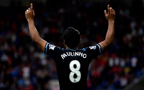 Paulinho of Tottenham celebrates after scoring the winning goal during the Barclays Premier League match between Cardiff City and Tottenham Hotspur at Cardiff City Stadium