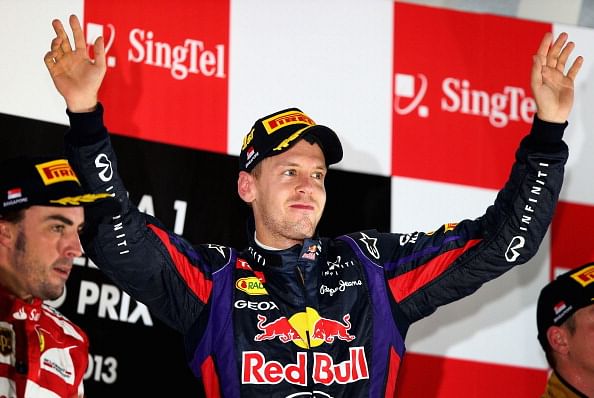 Red Bull driver Sebastian Vettel of Germany celebrates on his car