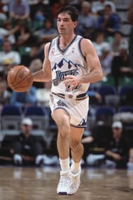 John Stockton #12 dribbles the ball