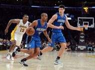 Arron Afflalo #4 of the Orlando Magic drives to the basket with Nikola Vucevic #9 as Metta World Peace #15 of the Los Angeles Lakers gives chase during a 113-103 Magic win at Staples Center on December 2, 2012 in Los Angeles, California. . (Getty Images)